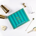 The Complete Cocktail Set displayed with gold and clear bar tools for home bartenders.