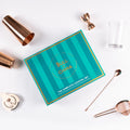 The Complete Cocktail Set displayed with tools like shakers, jigger, strainer, and elegant packaging on a white background.