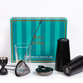 The Complete Cocktail Set featuring tools for mixing cocktails, including shakers, strainer, and measuring jigger.