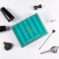 The Complete Cocktail Set displayed with tools like shakers, jigger, and strainer, perfect for home bartenders.
